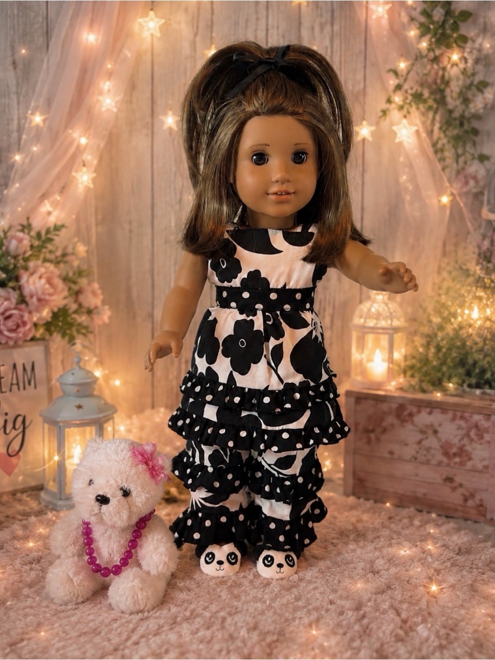 American Girl doll with white and black floral ruffle outfit